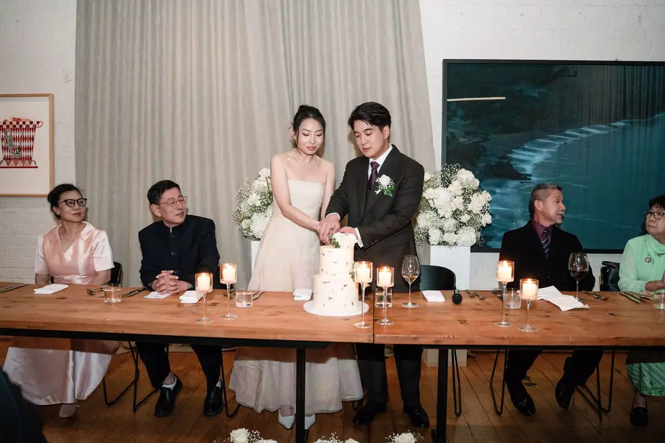 Amanda and Bryan cutting their wedding cake at The Hotel Britomart