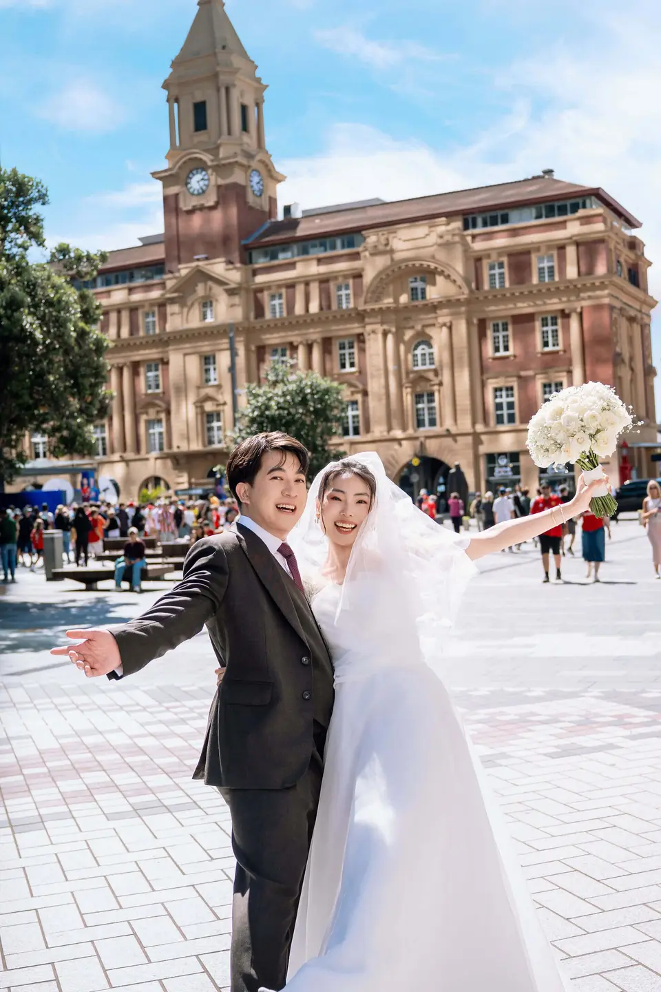 Amanda and Bryan walking through Britomart after their wedding