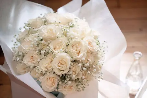 Amandas white rose hydrangea and babys breath bridal bouquet
