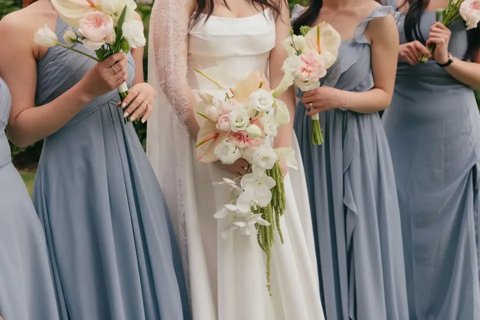 Claire and her bridesmaids with modern white blush and green wedding bouquets