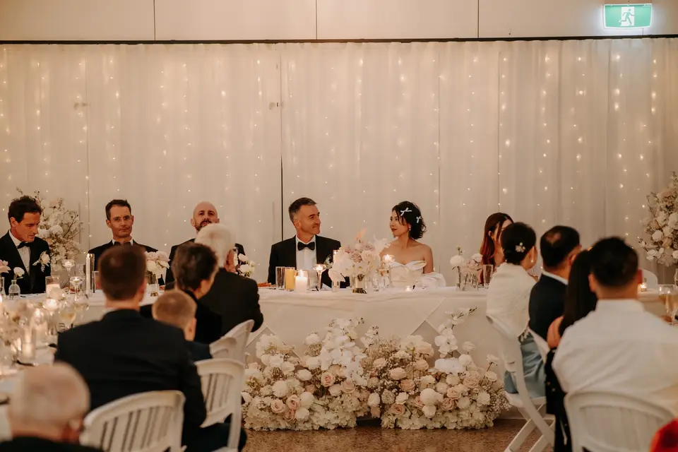 Clustered bud vases and taper candles for a modern romantic wedding reception