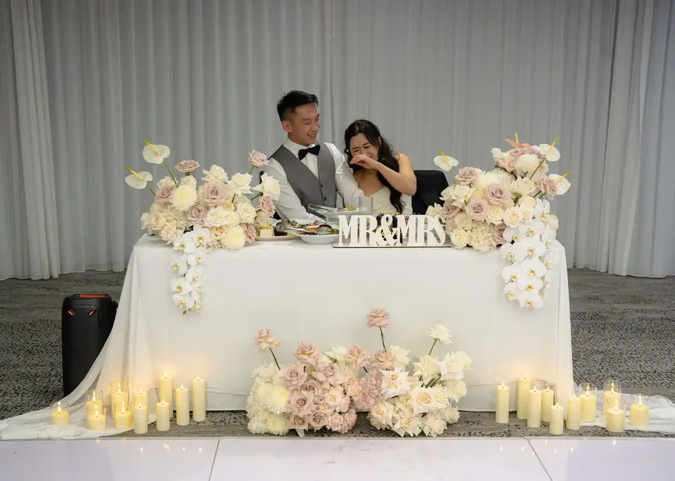 Elegant blush and white wedding reception flowers by Willow and Peony Auckland wedding florist