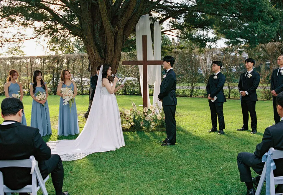 Film photograph of Claire with her modern cascading bridal bouquet