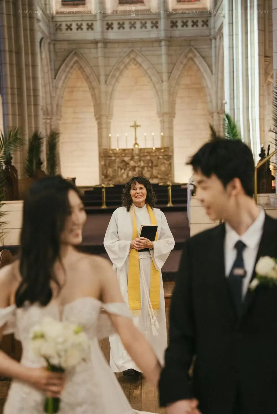 Kaelan and Tongtong with their celebrant at St Matthew-in-the-City
