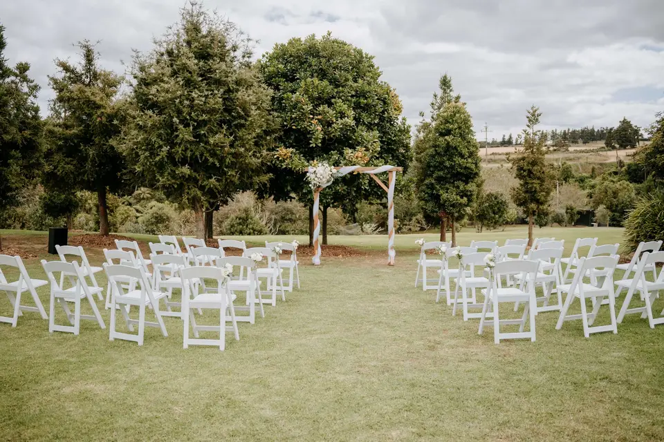 Romantic white wedding ceremony flowers at a family estate