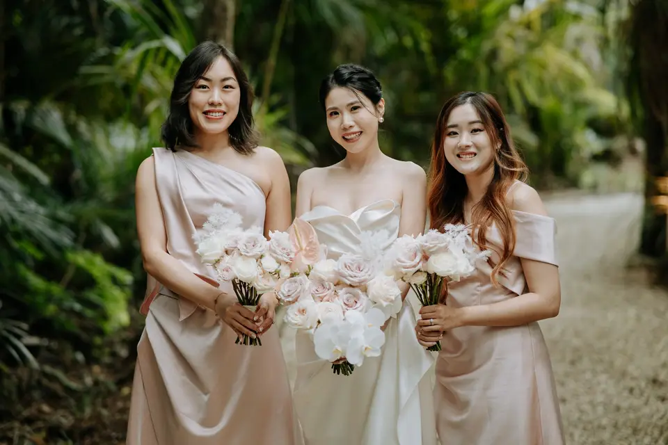 Sculptural flower-only bridal bouquet with blush roses, white orchids and preserved Ming fern