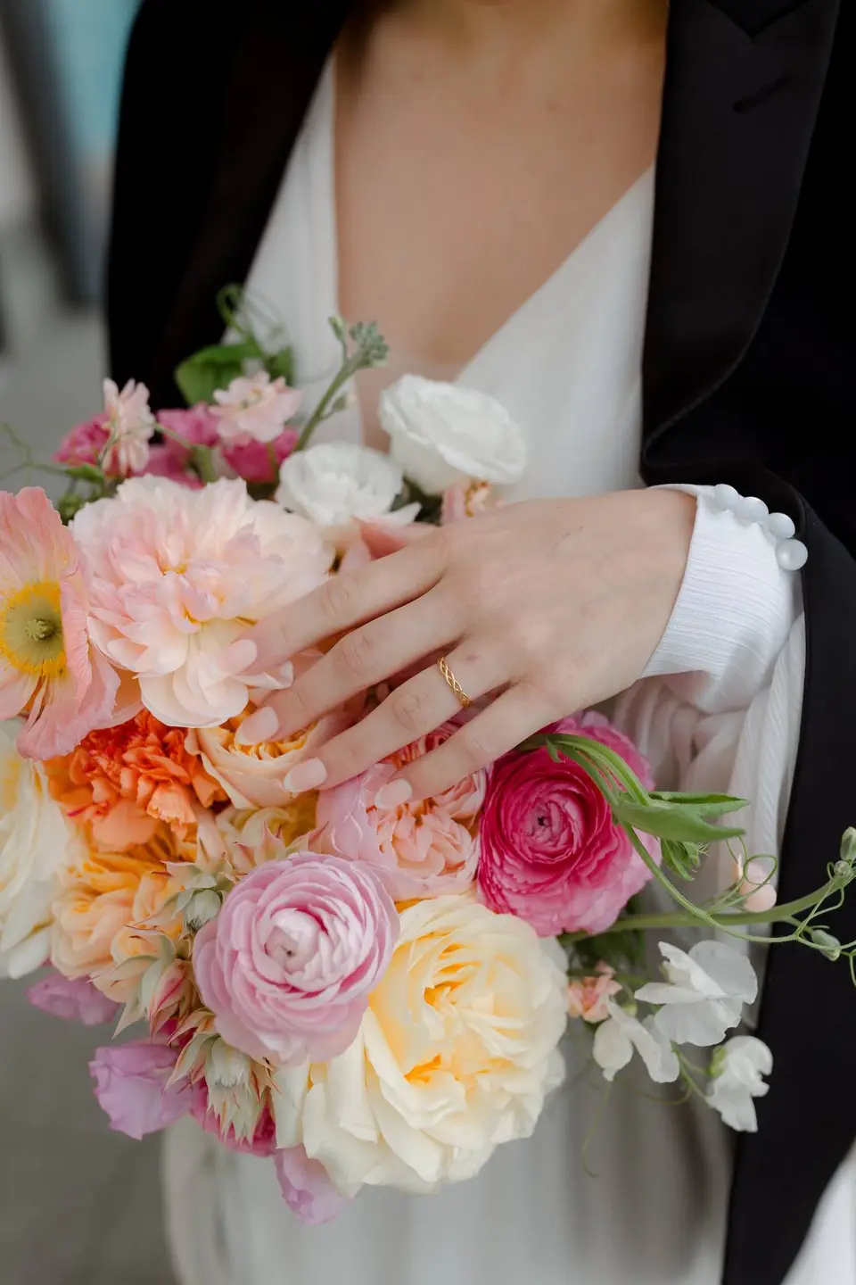 Bride holding a romantic pastel bridal bouquet in Auckland